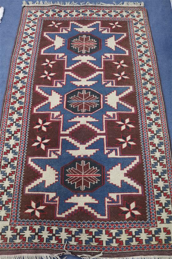 A Persian floral blue ground rug, 6ft 1in. x 3ft 6in.